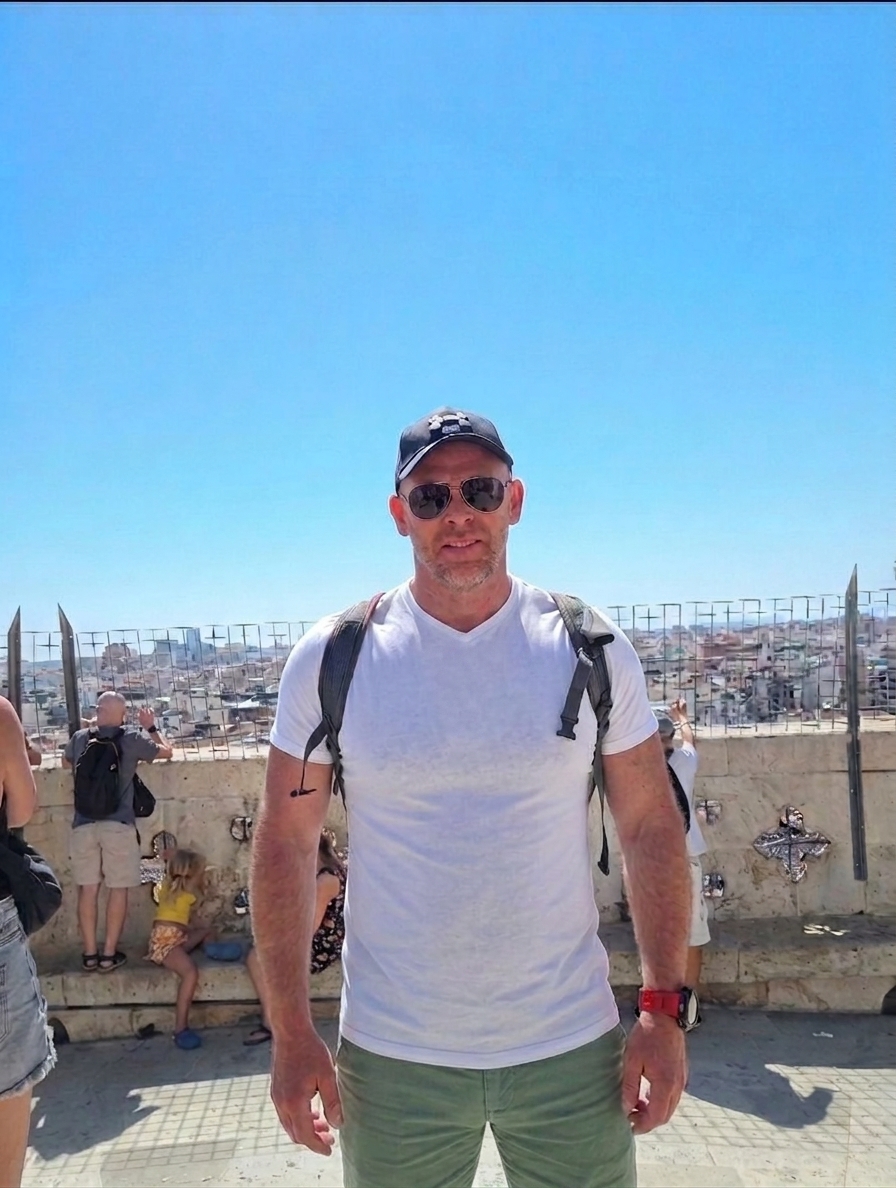Jason in shorts and t shirt on holiday